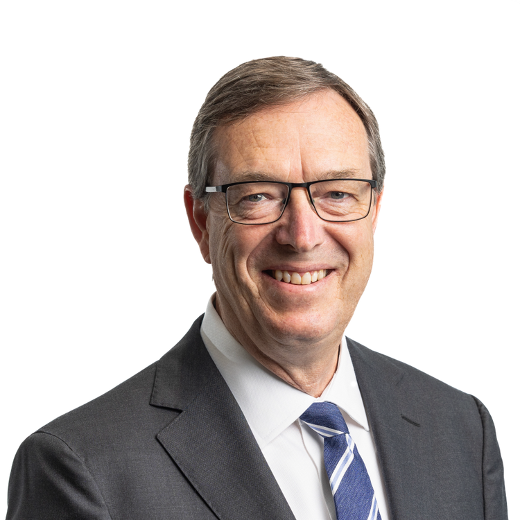 man wearing suit and tie smiling in profile photo