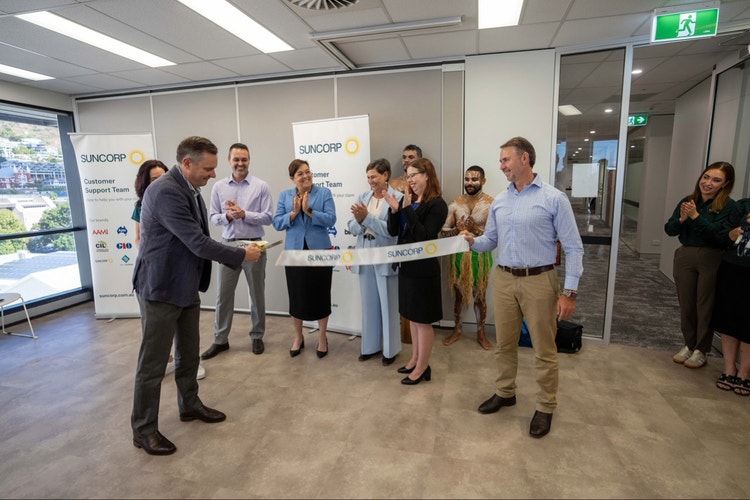 CEO steve cutting ribbon at townsville office