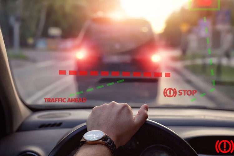 person driving car looking out dashboard