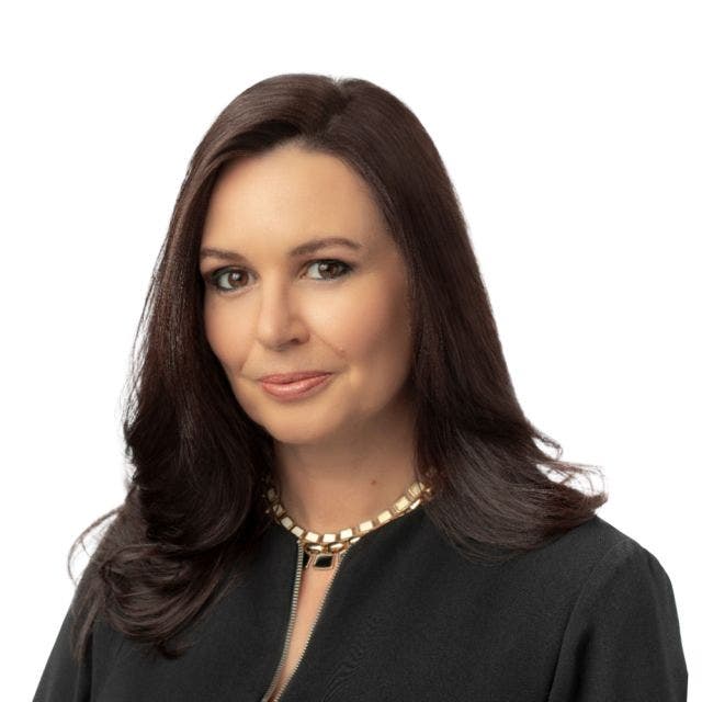 woman in black dress headshot