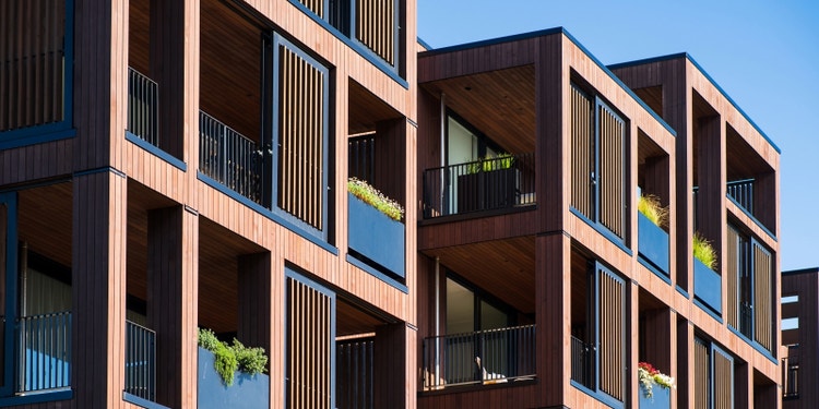 strata buildings against a blue sky